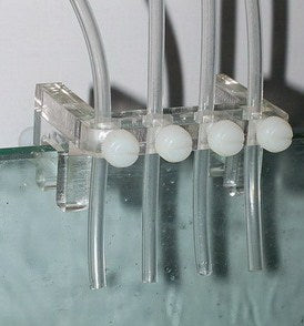 Soft tube fixture for dosing pump for 4 tubes